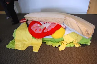 Children interacting with soft sandwich ingredients inside the Make Yourself a Sandwich! installation